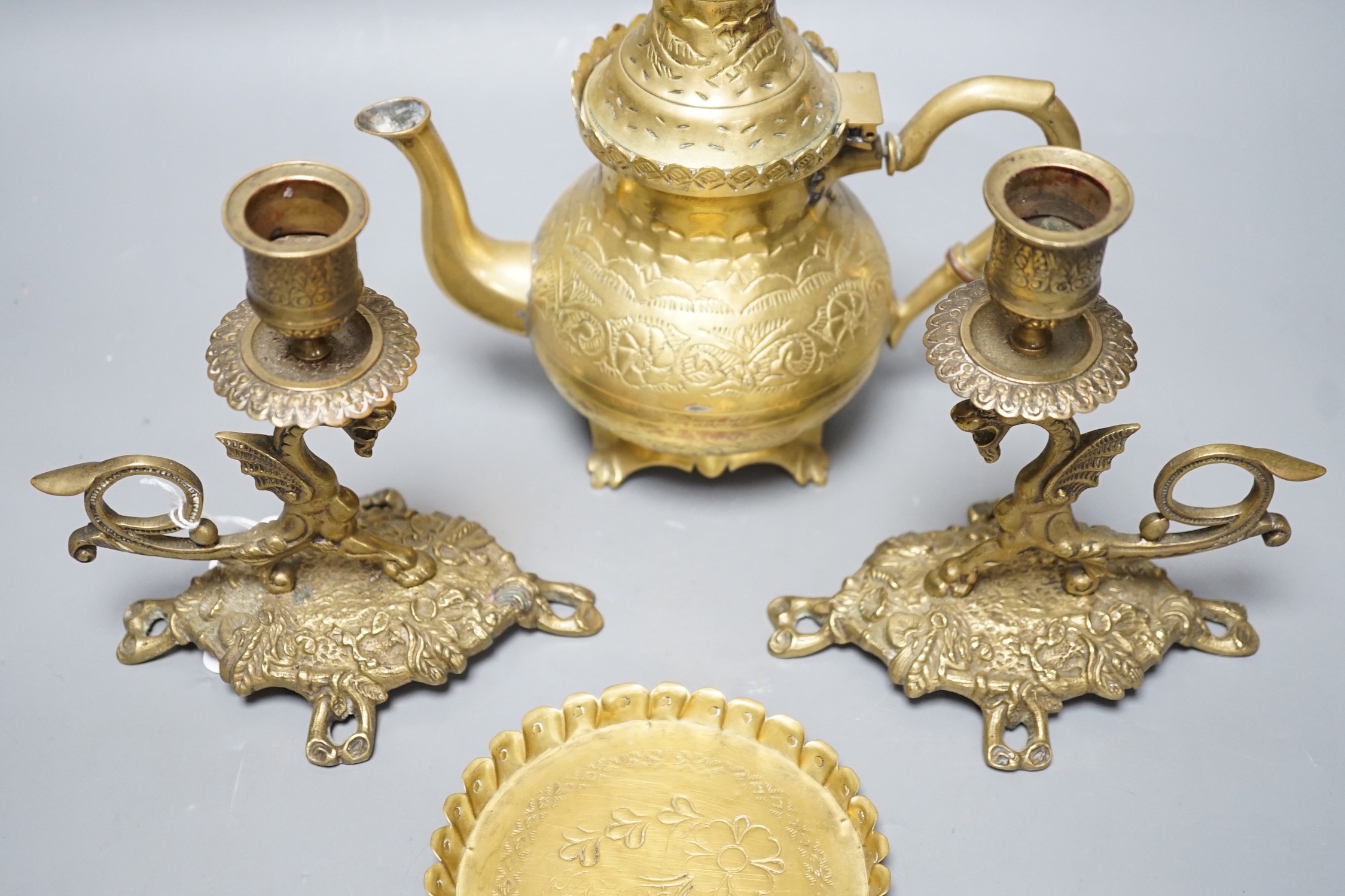 A pair of French brass 'dragon' candlesticks, a similar teapot and stand, tallest 20cm